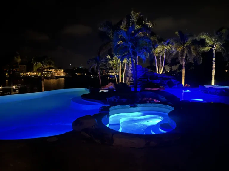 Blue LED commercial pool lighting at night meeting Florida code