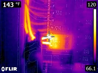 Thermal image of an electrical panel with a bad breaker reading 143 degrees Fahrenheit