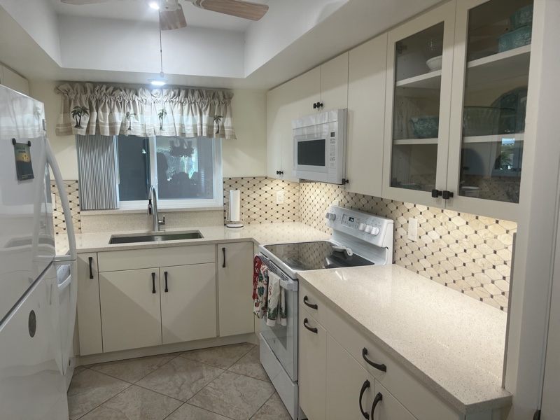 Modern white kitchen remodel with new electrical — Pinellas County FL